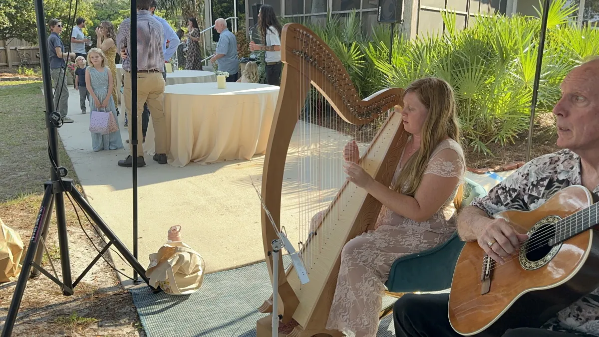 Hilary Turner performing at an outdoor Gulf Coast event.
